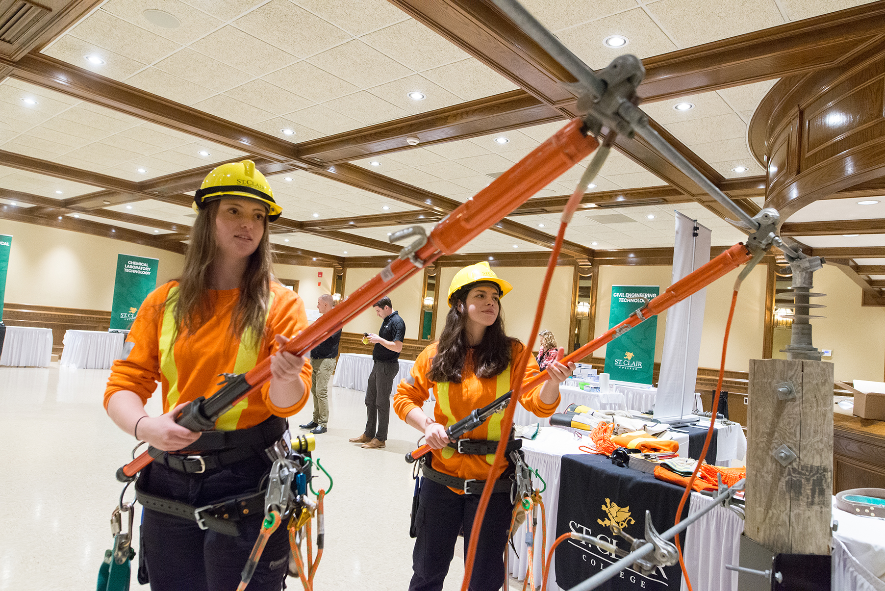 Powerline Tech reps from St. Clair College demonstrate some of their powerline training at a Build a Dream career discovery expo in Windsor, Ontario.